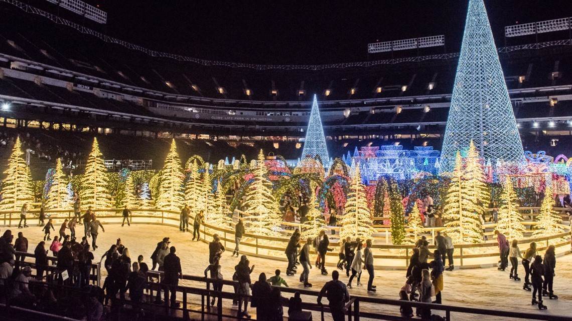 Families skate around a lareg Christmas light maze and Ice rink at National Park in Washington D.C.