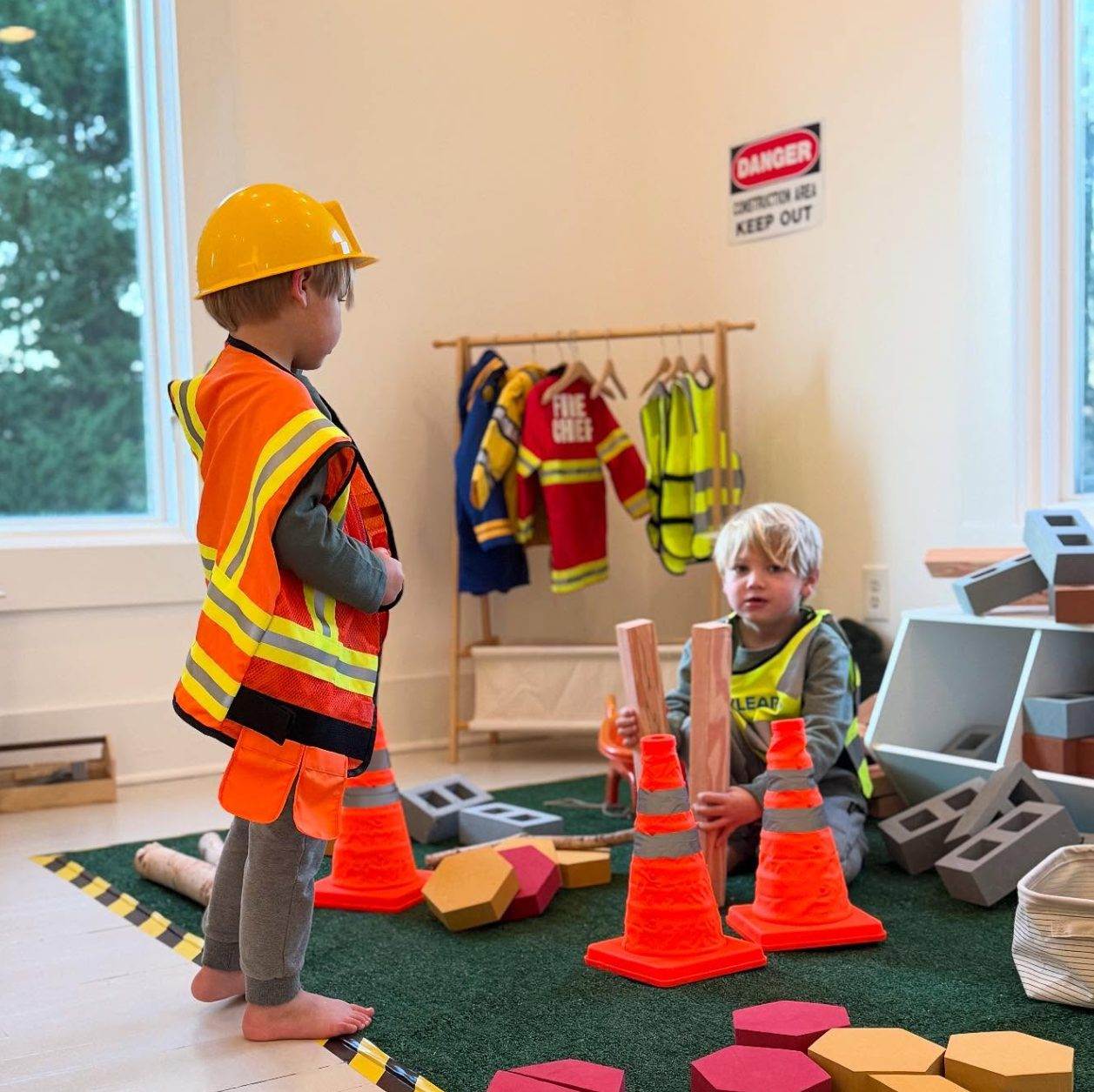 Teo little boys playing in mock construction site at Iy House Play Space.