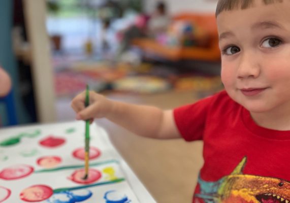 boy doing arts and crafts