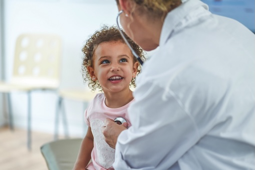A Charlottesville pediatrician is listening to a little girls heartbeat.